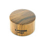 Pisoni ebony cutting block with rubber grip.  3.2 cm diameter.