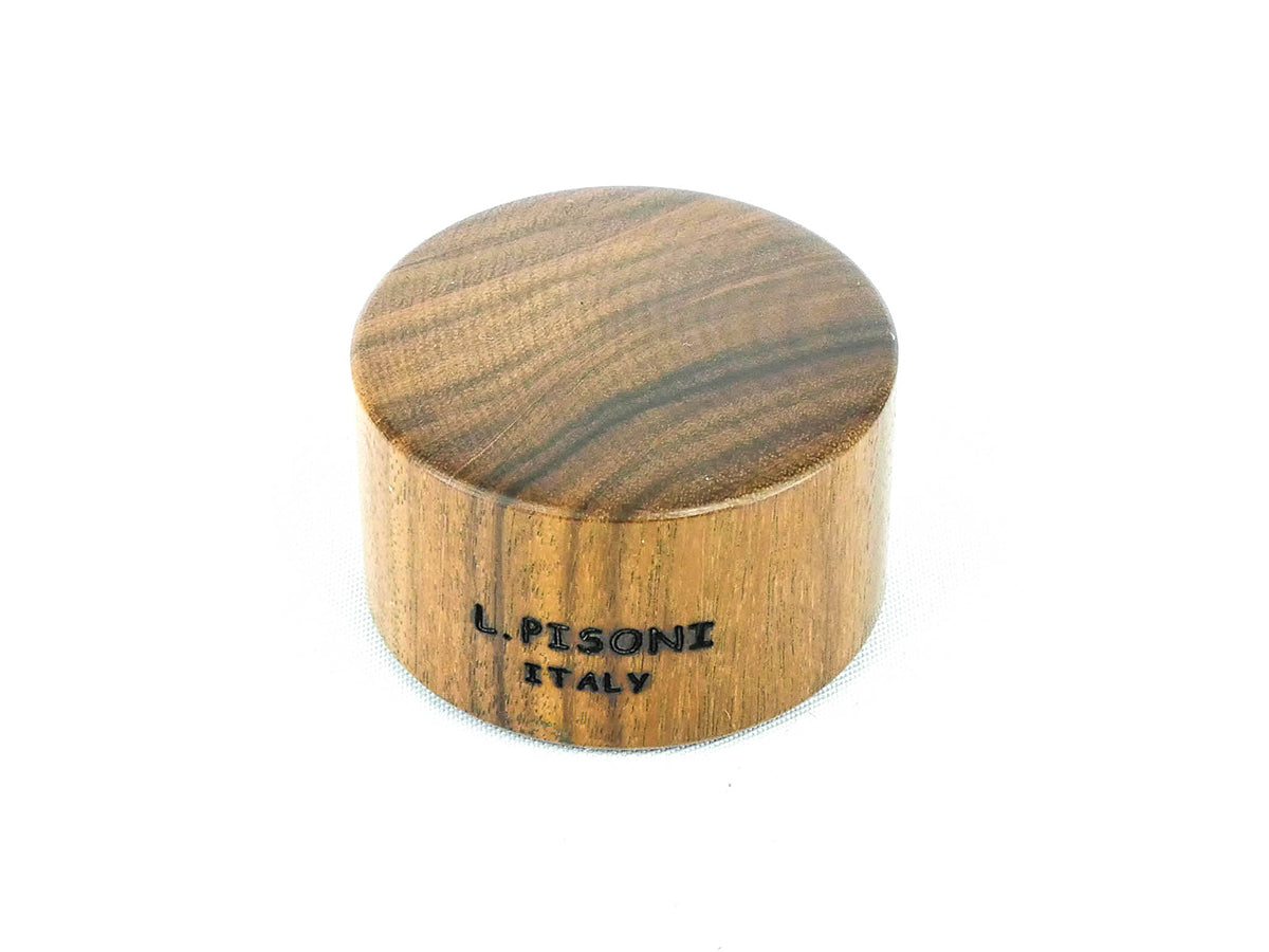 Pisoni ebony cutting block with rubber grip.  3.2 cm diameter.